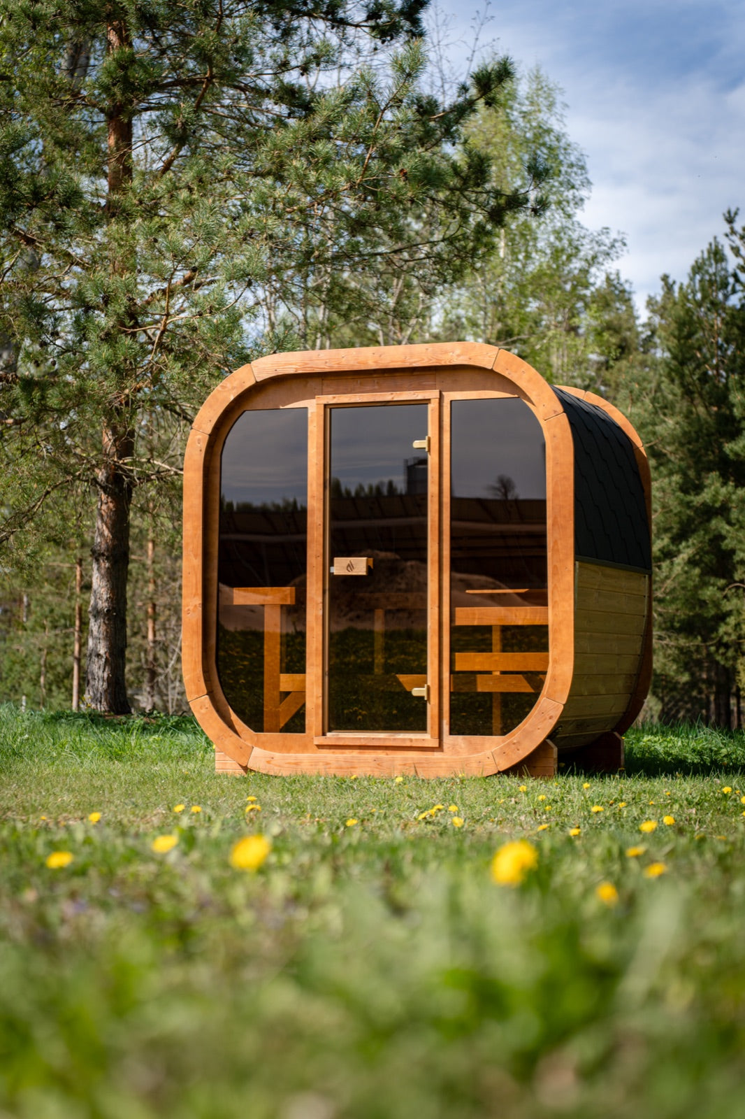 Max Traditional Sauna 2.0, full glass front, in a forest clearing